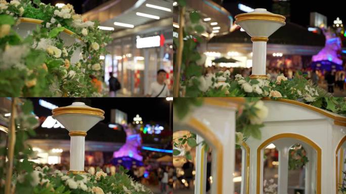 商场夜晚装饰有花朵的小火车