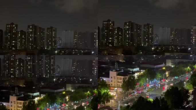 雨夜城市楼房下摇车流天空电闪雷鸣