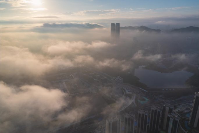 航拍5.4K深圳龙华星河双子塔日出平流雾