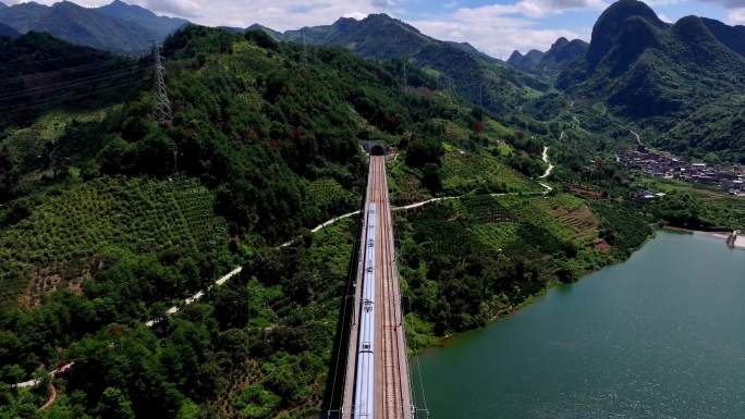 航拍广西桂林高铁行驶在高架桥上