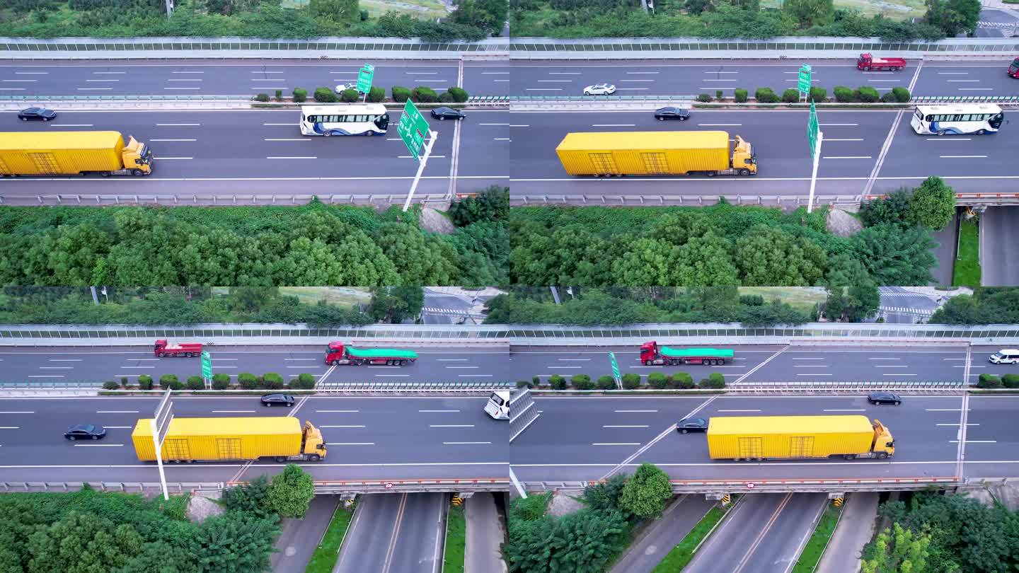 黄色箱货车辆行驶在高速侧面航拍