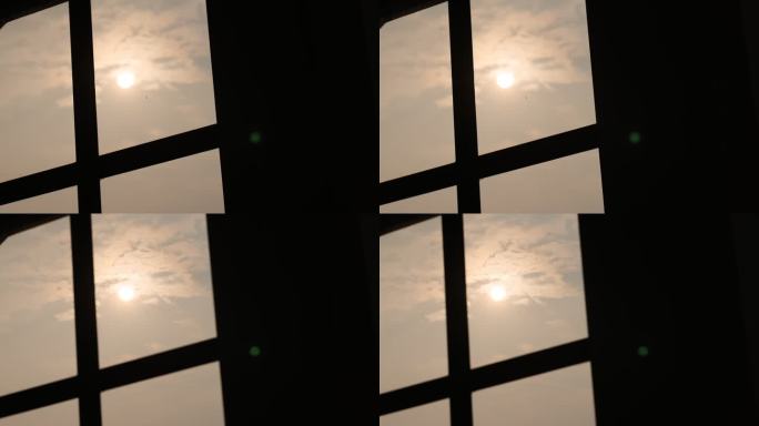 窗户剪影玻璃窗太阳云彩天空窗外景色室内外