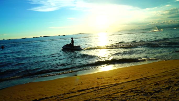 海边夕阳下的摩托艇 摩托艇 落日 海边