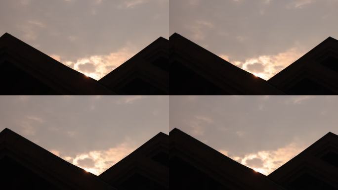 飞机三角形建筑剪影朝霞日出天空云层变化