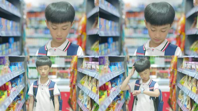 小朋友在超市低头对电话手表说话