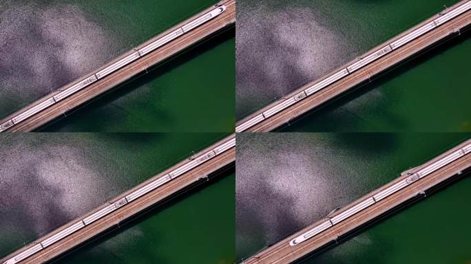 俯拍桂林高铁行驶的动车 碧绿的湖泊