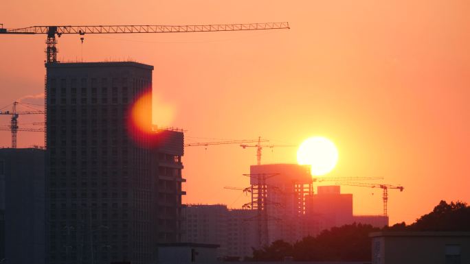 城市工地夕阳西下 太阳落山4k延时视频