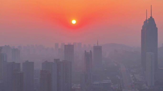 航拍枣庄早晨太阳升起的雾霾天气