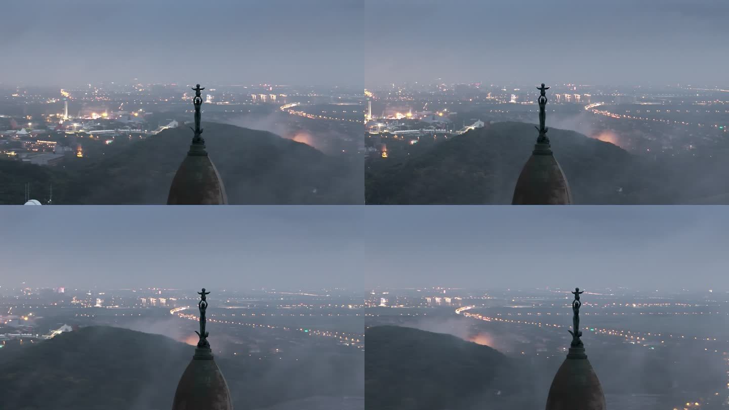 航拍夜晚雾气中的教堂圣母像雕塑