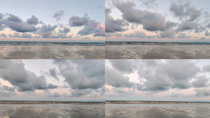 海边沙滩海水白云落日