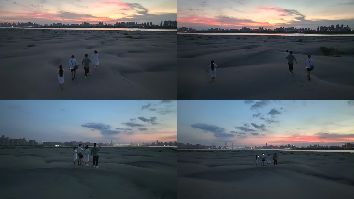 四人在武汉天兴洲沙漠行走奔跑欣赏绝美晚霞