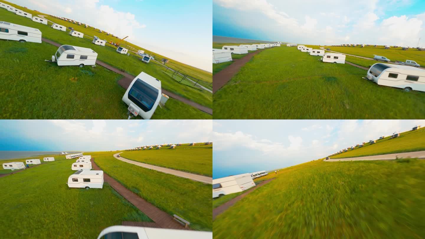 FPV拍摄行驶在草原上的房车基地