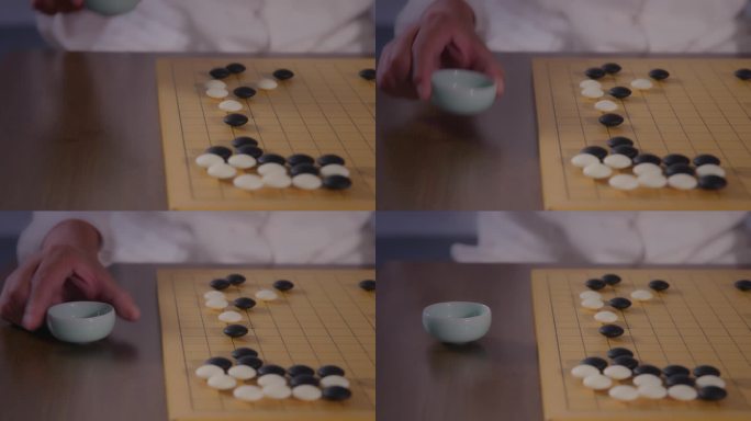 围棋棋局大师对弈思考创意人生放茶杯