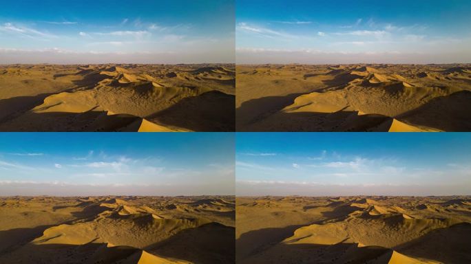 夕阳下沙漠的航拍延时光影变化
