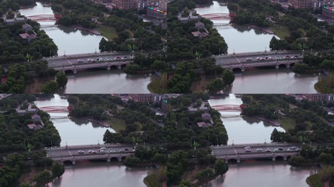 航拍五龙湖公园舞龙桥与茸梅路桥城市交通