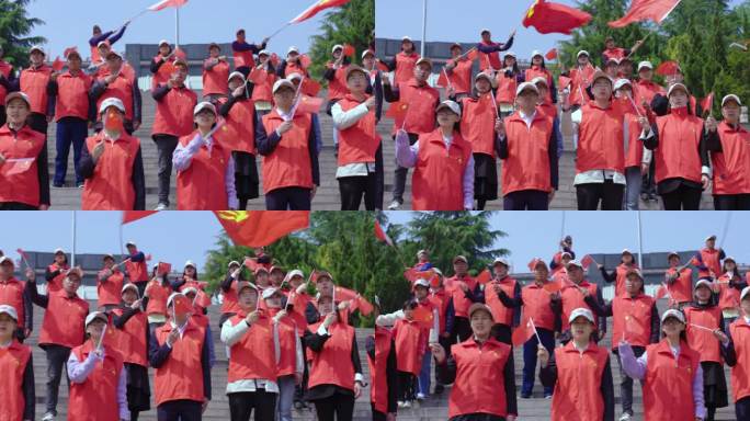 国庆手持国旗唱红歌祝福祖国的党员人民群众