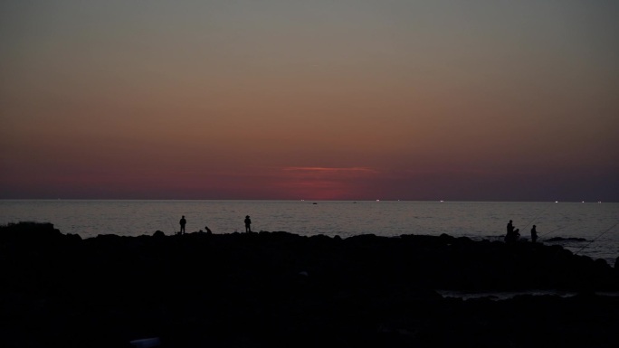 夕阳海钓海边紫色天空夕阳