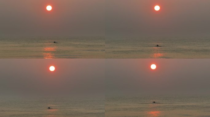 日落下驶向大海的渔船