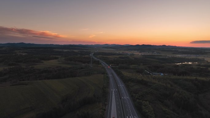 航拍夕阳下的高速公路