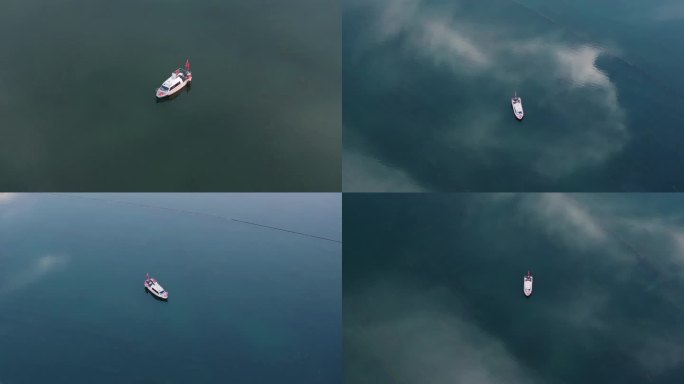 湖面上停泊的船只多云天空之镜梦幻航拍镜面