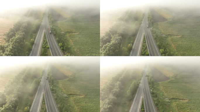 晨雾中国道上行驶的汽车