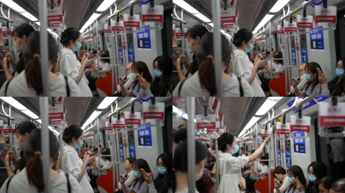 女地铁看手机女孩地铁看手机白领地铁看手机