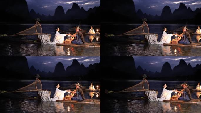 桂林漓江竹筏上的美女与渔夫对饮