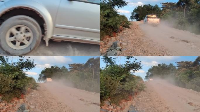 小车开过石头山坡灰尘路汽车车尾灰尘滚滚