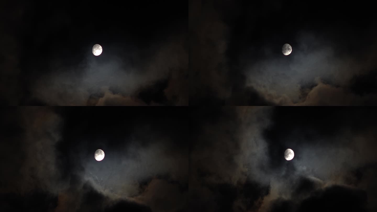 夜晚被乌云包裹着的月亮