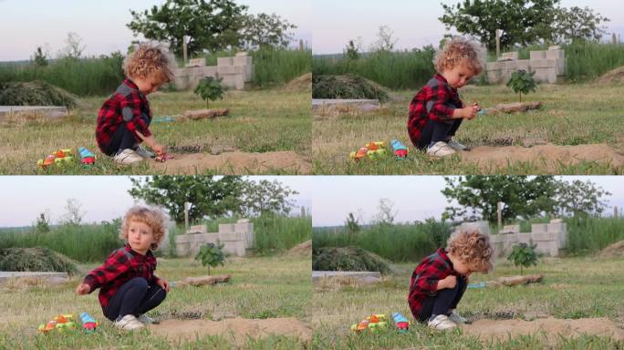一个穿着格子衬衫的两岁男孩向一架正在飞行的飞机挥手，看着远处的天空，然后在村里一所房子的院子里的草坪