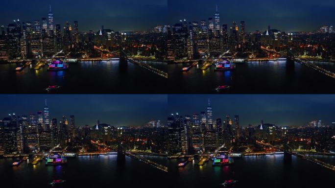 纽约的摩天大楼在夜晚灯火通明。从河边可以看到美丽的建筑。顶部视角。