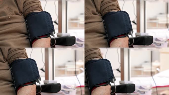 老年妇女手臂上的血压计特写。高品质的4k画面。