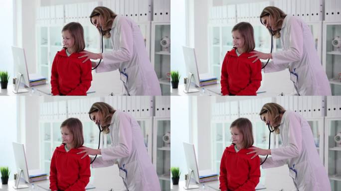 可爱的孩子病人医生儿科医生护士用听诊器听小女孩说话