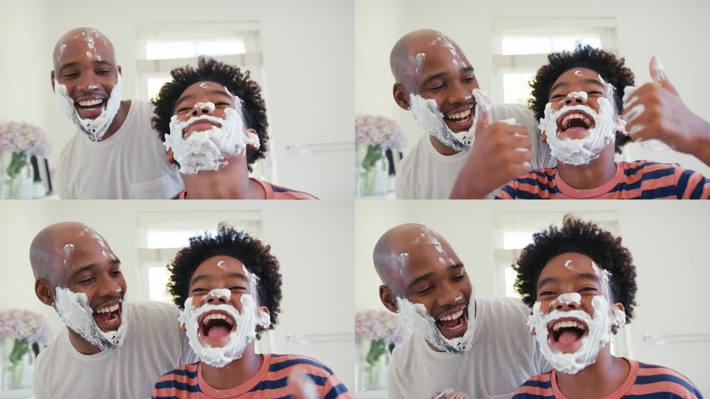 父亲和儿子在家里玩剃须泡沫，在浴室弄得一团糟