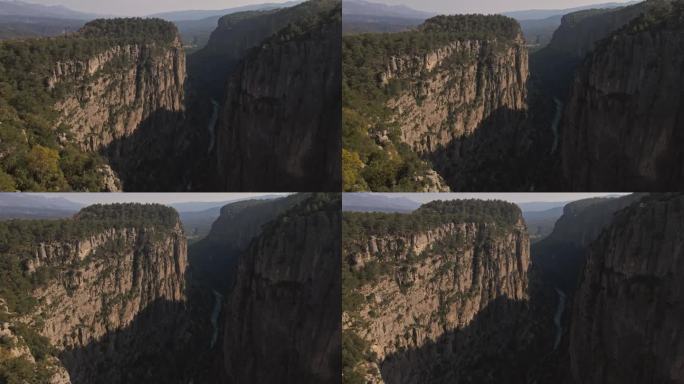 自然奇观，高山峡谷景观，史诗级空中无人机飞行，巨大的悬崖和岩石，戏剧性的地质奇观。鸟瞰4k。塔兹峡谷
