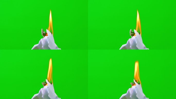 火焰燃烧白纸在绿色的屏幕背景