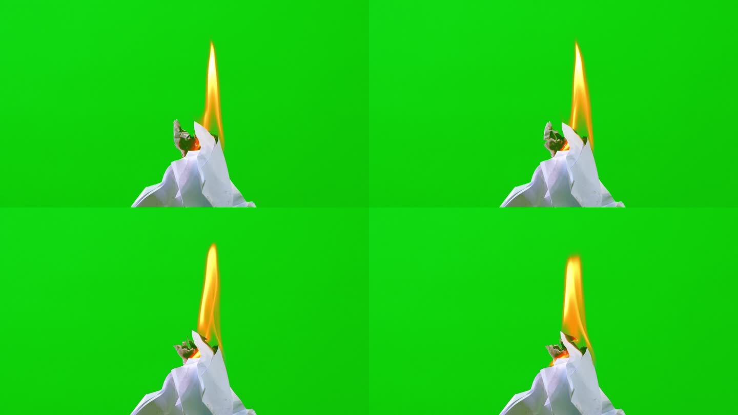 火焰燃烧白纸在绿色的屏幕背景