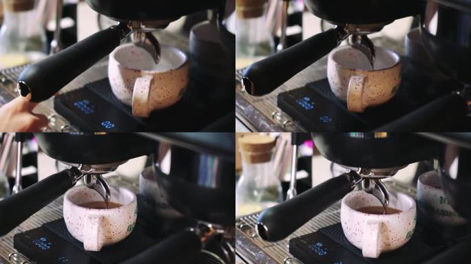 视频咖啡从机器流到杯子里。自制的热浓咖啡。现磨咖啡流。咖啡师在咖啡馆准备咖啡。