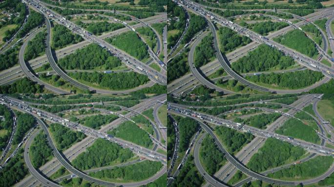 鸟瞰图上的交通在一个主要的高速公路交汇处，满是汽车和卡车。用红色武器8K拍摄。