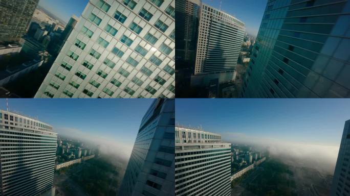 第一人称无人机飞行观看一个巨大的熙熙攘攘的城市景观与玻璃摩天大楼