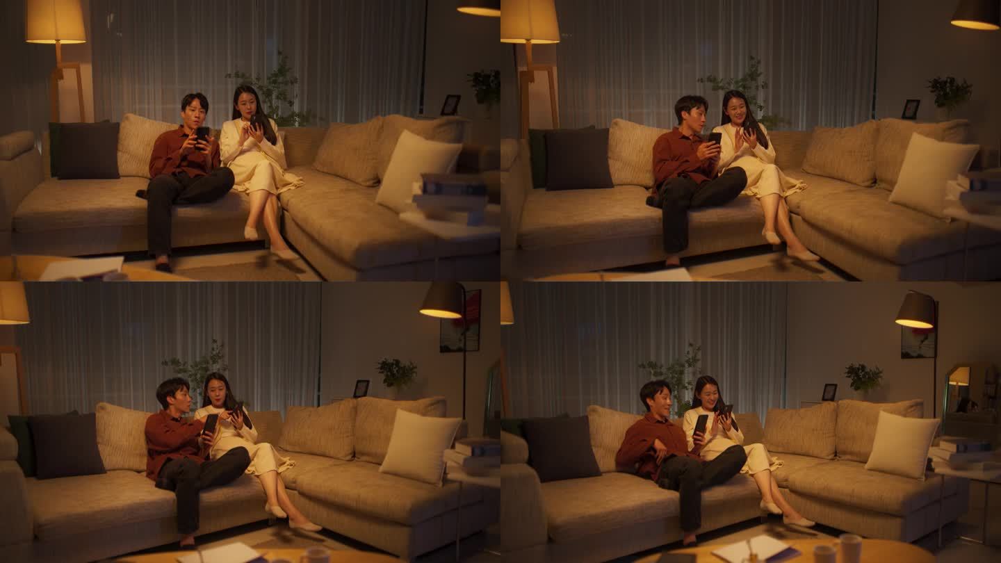 韩国夫妇晚上在家享受休闲时光，两人都用智能手机网购。寻找特价商品的男人和女人。女友向男友寻求建议