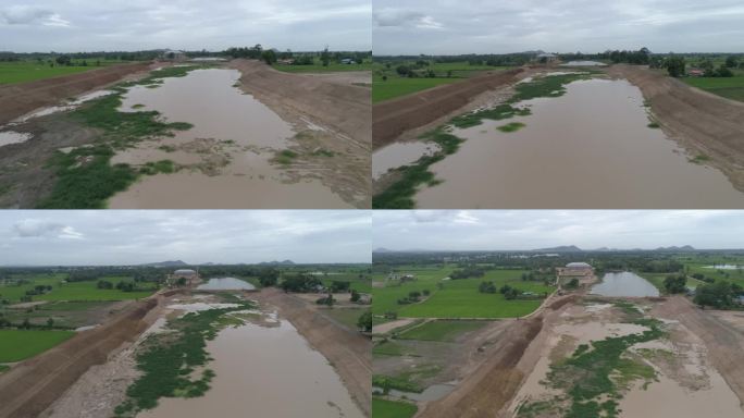 为了防止雨季的洪水，正在修建运河和大坝。日期:2021年5月14日，泰国乌泰他尼省。