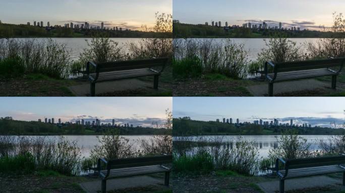 在城市公园的湖边观看的充满活力的日落的时间流逝。摄于加拿大不列颠哥伦比亚省大温哥华的本拿比