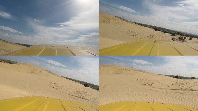 在越南美奈镇的沙丘上，汽车撞沙丘。
白天，极限冒险车行驶在沙漠上。