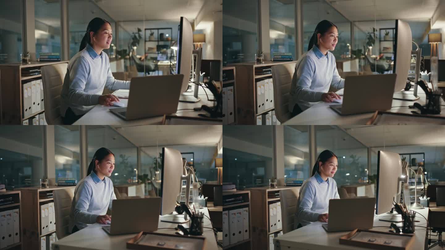 网页设计，电脑和女人晚上在办公室做一个有截止日期的项目。技术、加班和年轻的亚洲女性开发人员在一个在线