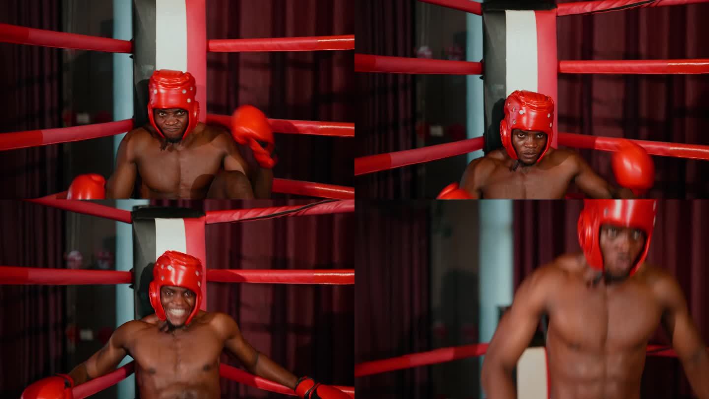 非洲年轻的成年拳击手，带着一套拳套，疲惫地坐在拳击台的转盘上。