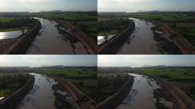 为了防止雨季的洪水，正在修建运河和大坝。日期:2021年5月14日，泰国乌泰他尼省。