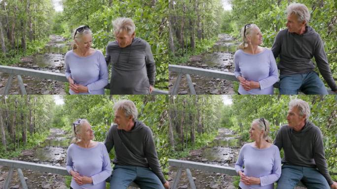 一对老年夫妇在溪桥上一起享受时光