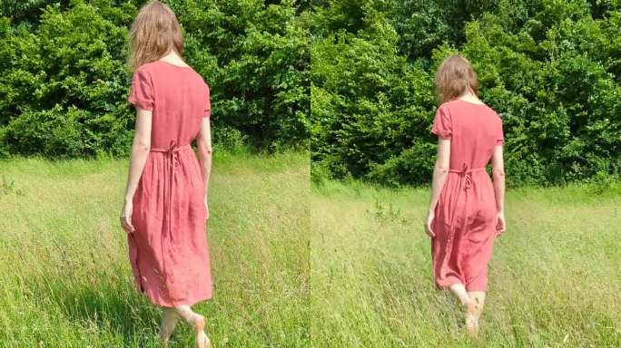 美丽的白种女人，穿着红衣服，微笑着走在夏日的田野上。呼吸新鲜空气，和谐放松。人与自然的统一。垂直的画