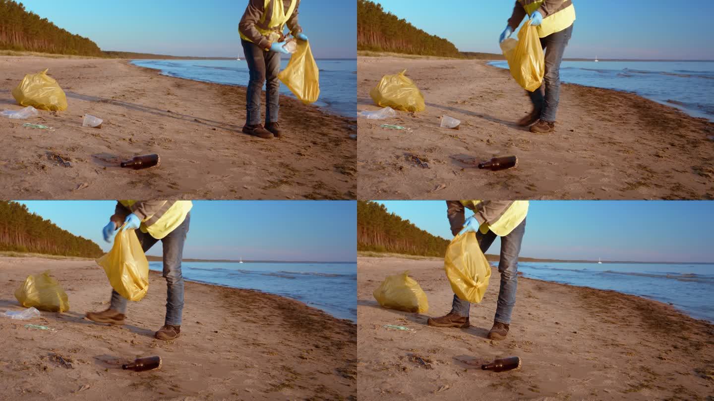 男子收集垃圾海滩塑料危机的重要性抗击塑料污染